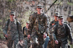 men in camouflage uniform standing on field during daytime