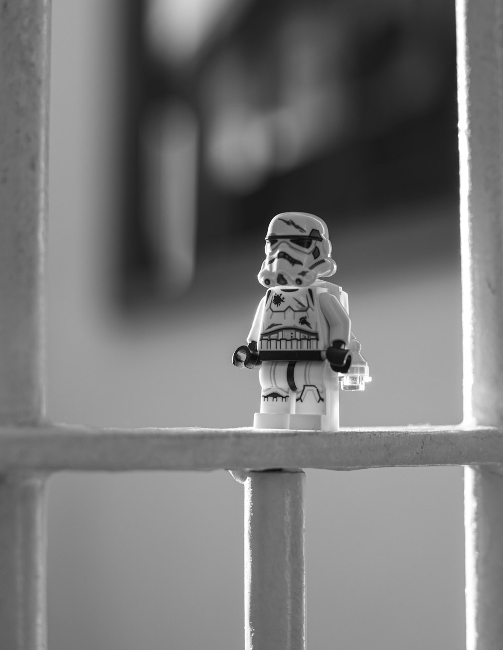 lego minifig on white metal bar