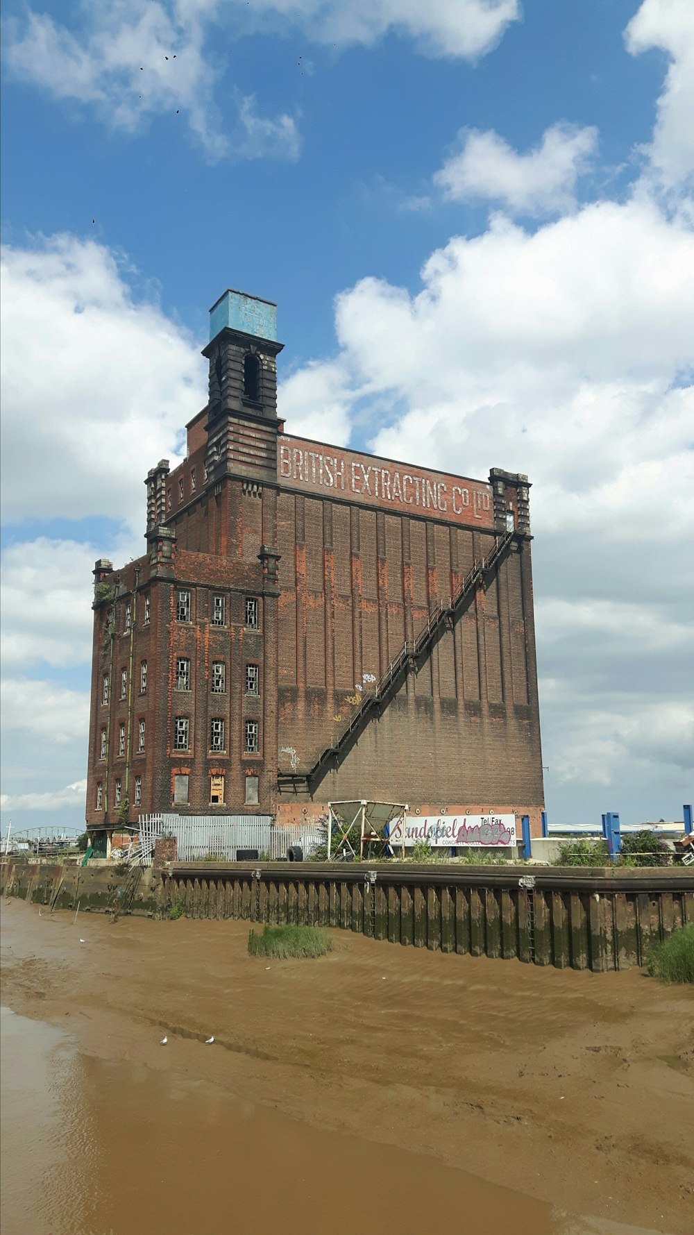 brown concrete building under blue sky during daytime