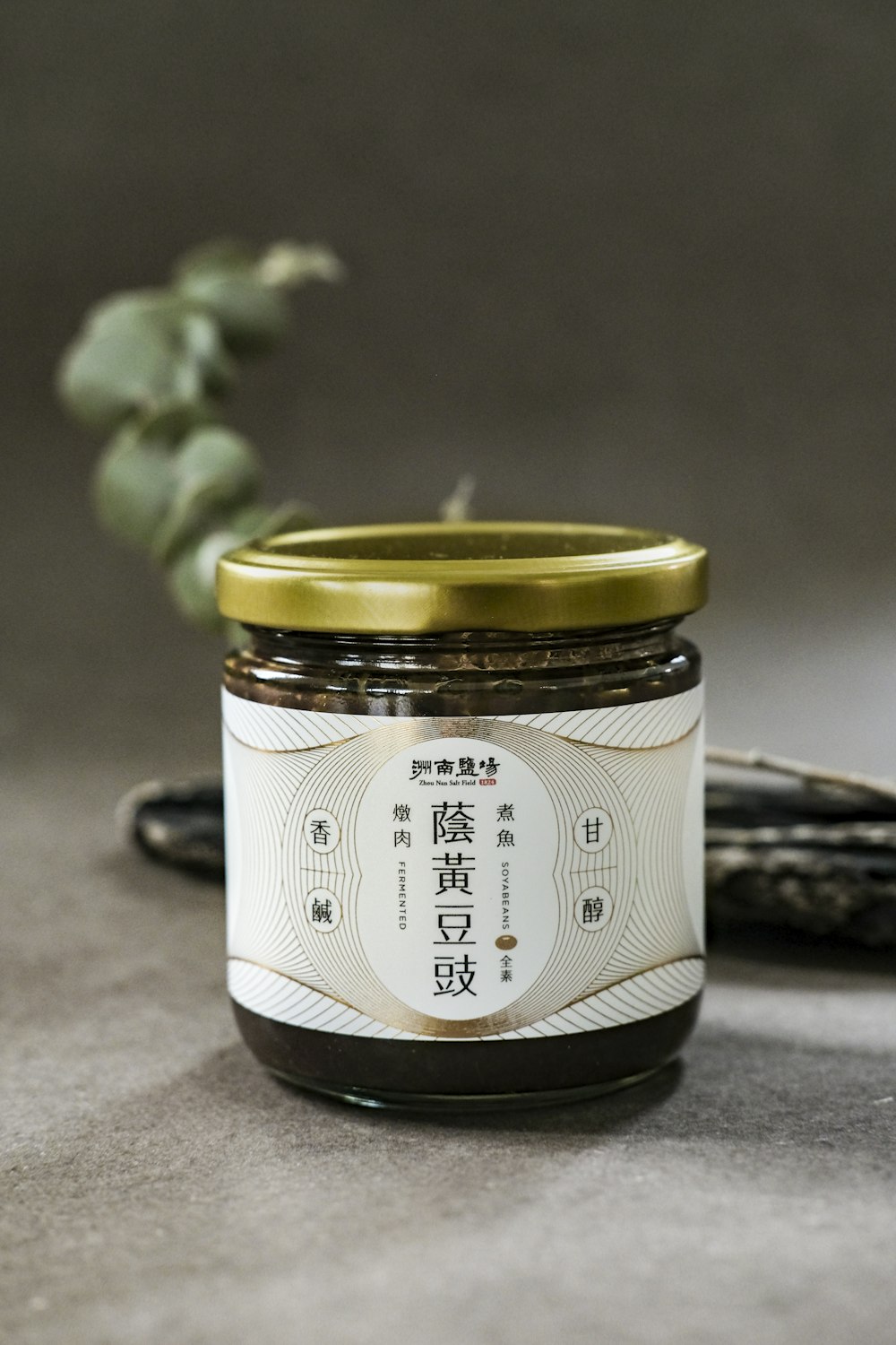 white and black labeled jar