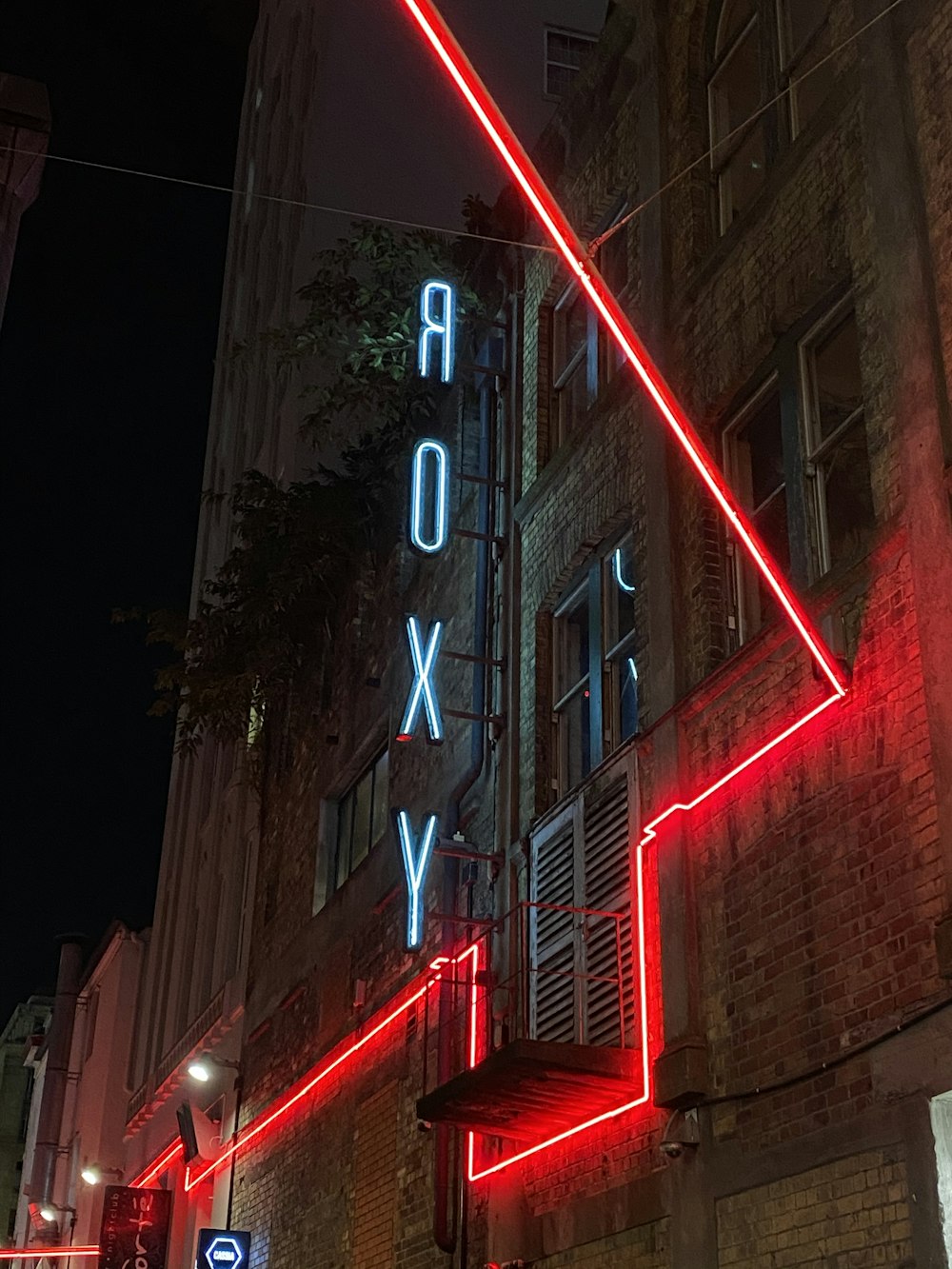 red and white led light on building during night time