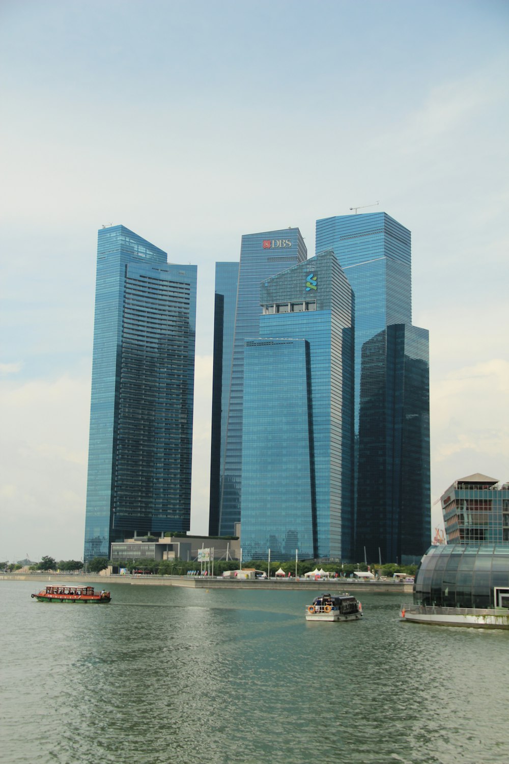 gray concrete building near body of water during daytime