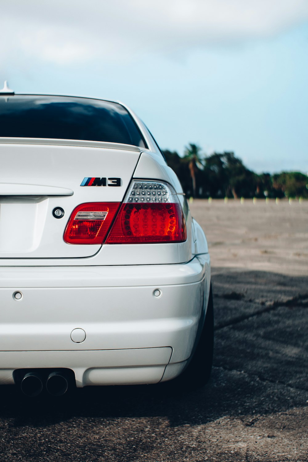 white bmw m 3 on road during daytime