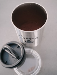 silver and white disposable cup