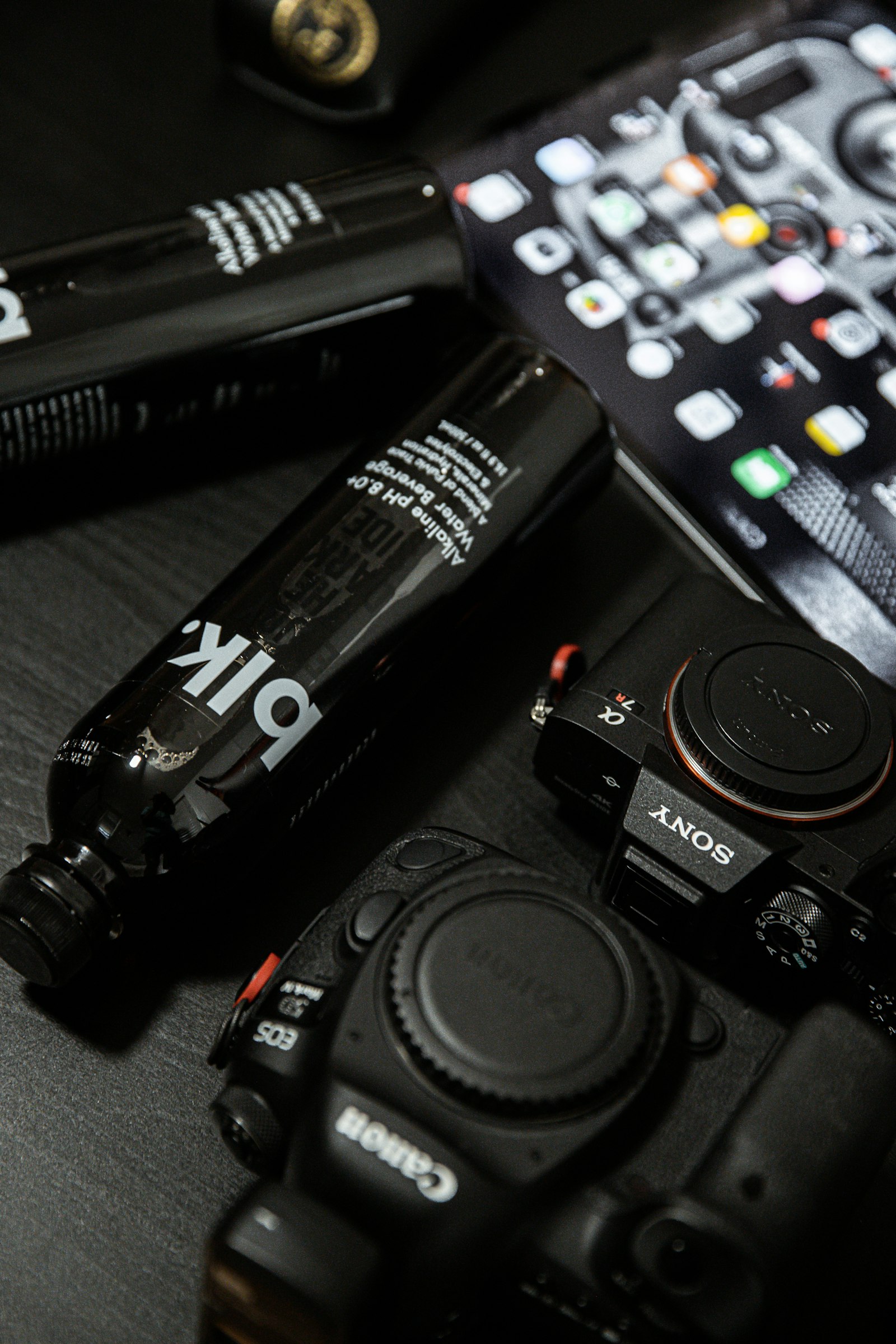 Canon EOS 6D Mark II + Canon EF 24-70mm F2.8L II USM sample photo. Black remote control beside photography