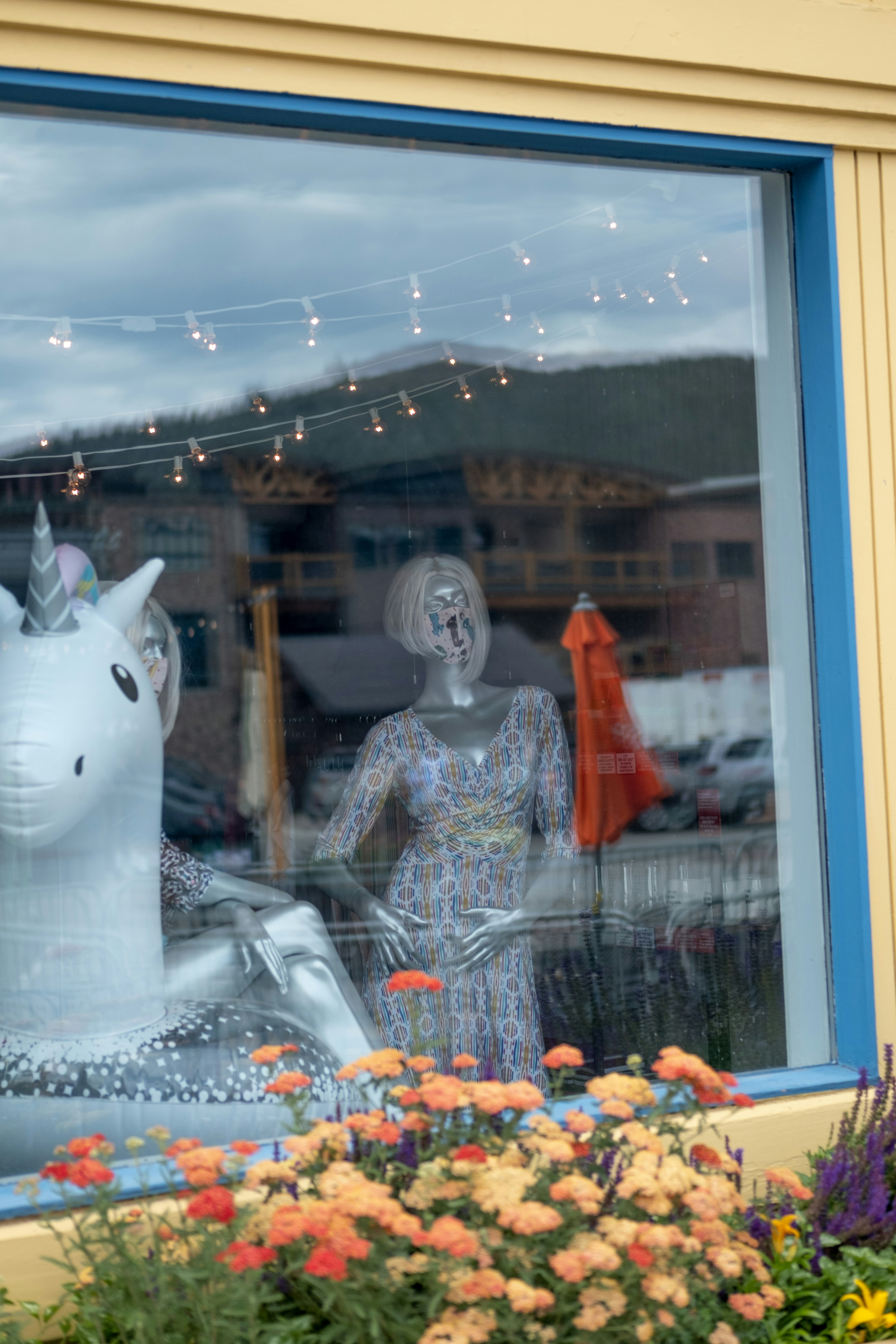 white ceramic cat figurine on glass shelf