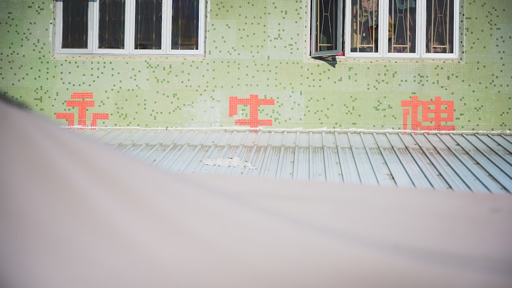 white and green concrete house