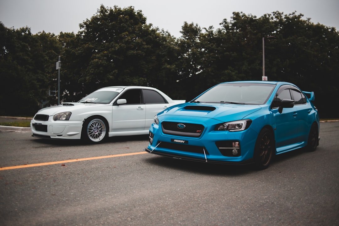 blue bmw m 3 parked on parking lot during daytime