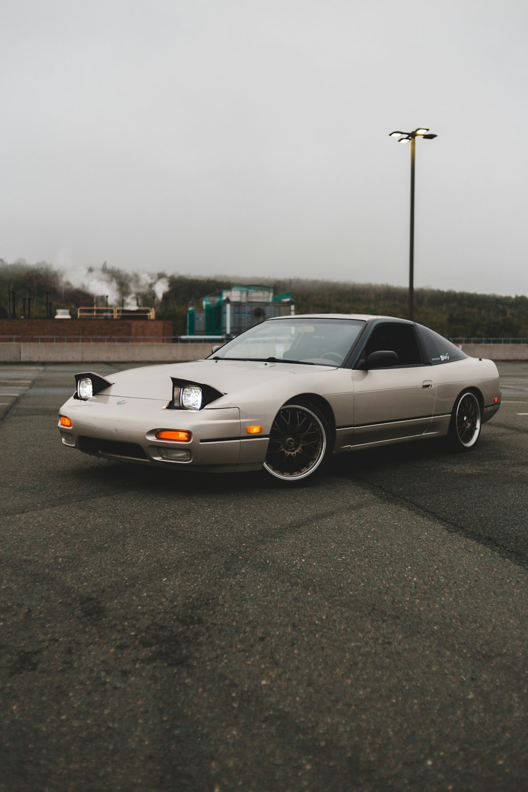 white coupe on road during daytime