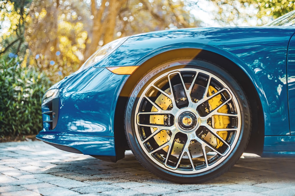blue car with yellow wheel