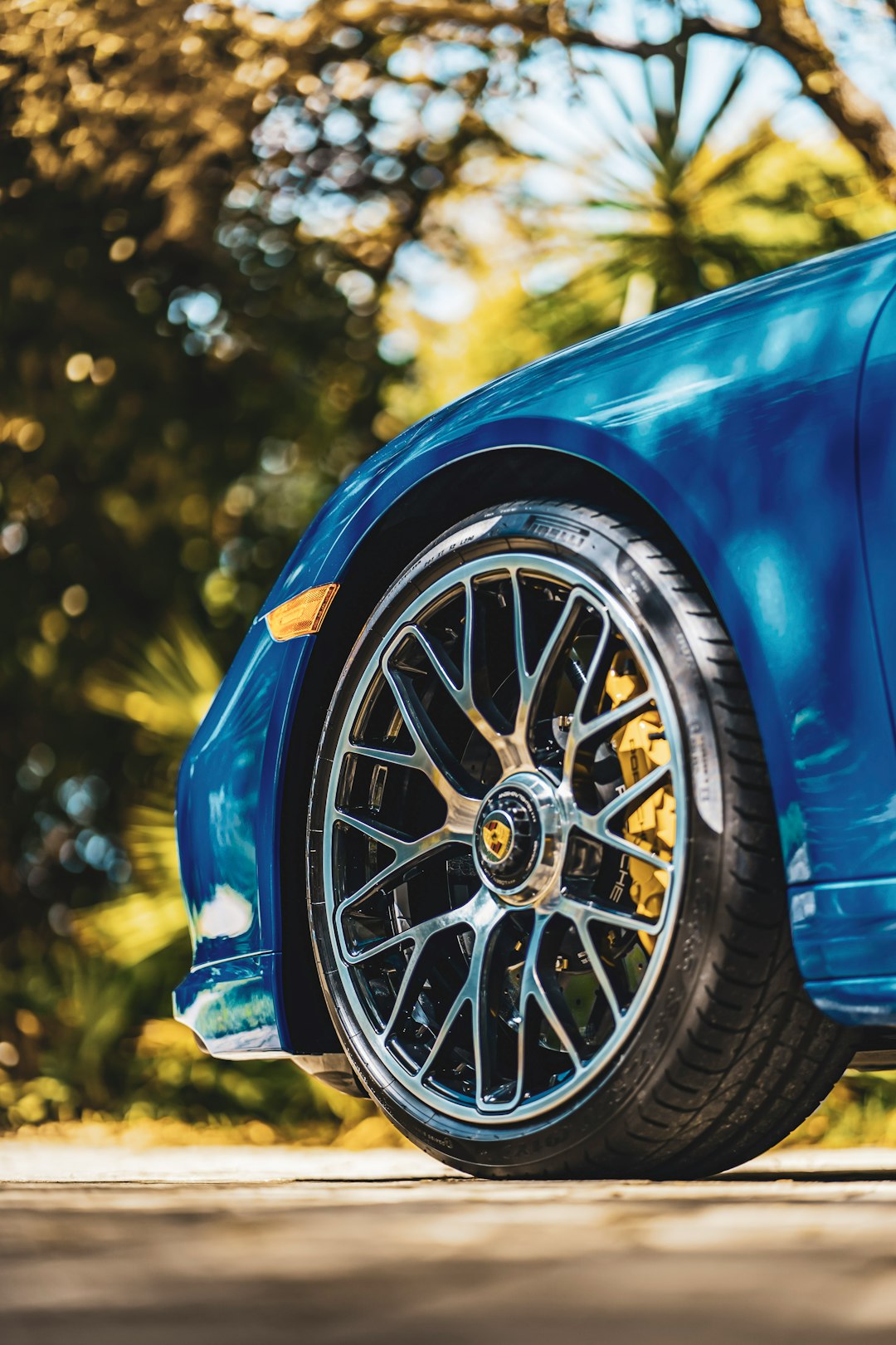 blue car with chrome wheel