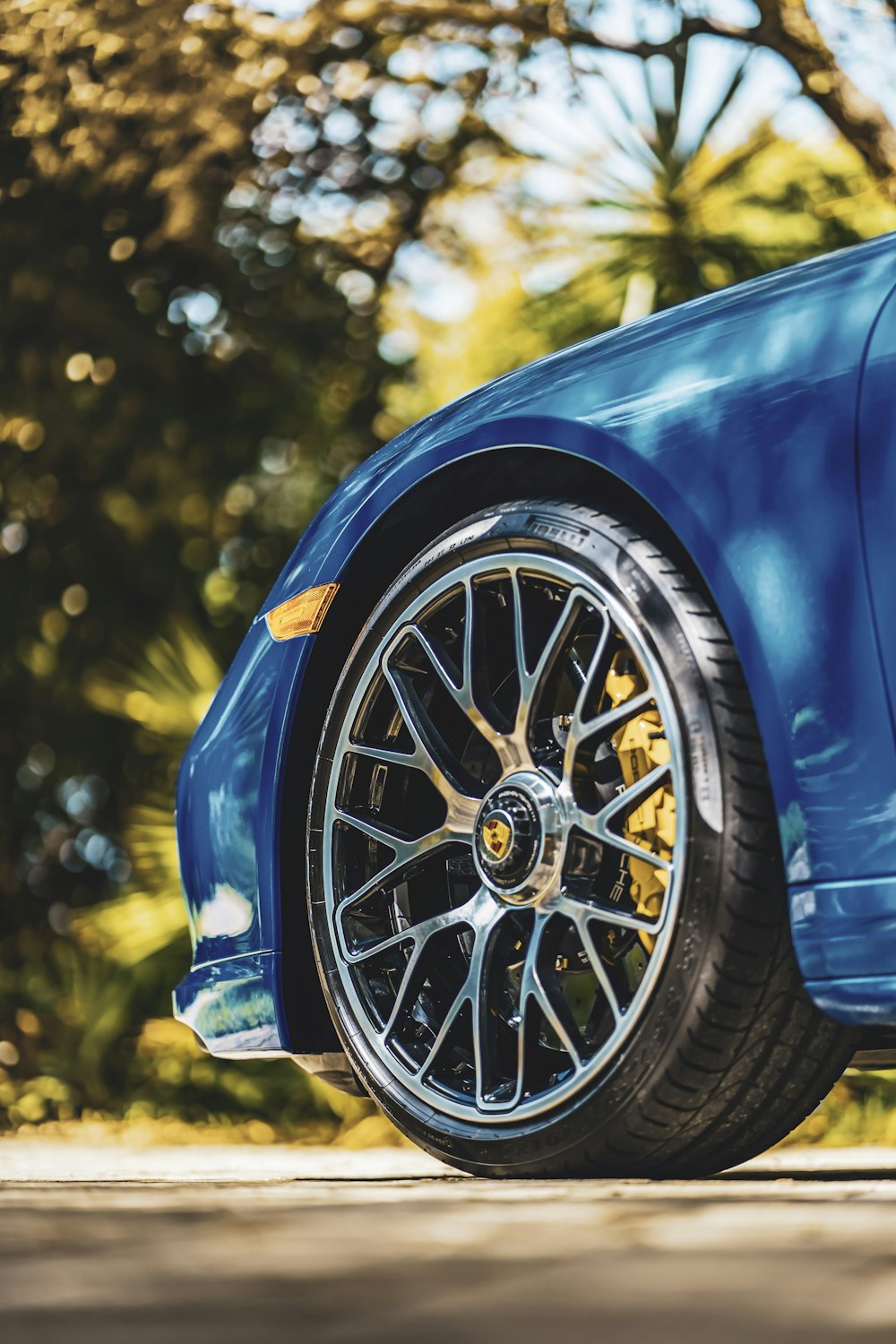 blue car with chrome wheel