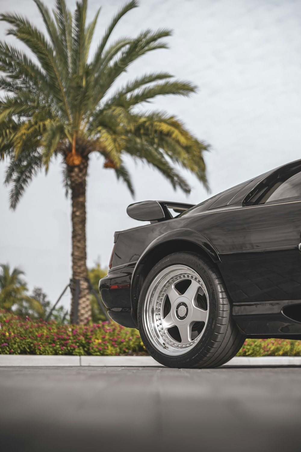 black porsche 911 parked on parking lot during daytime