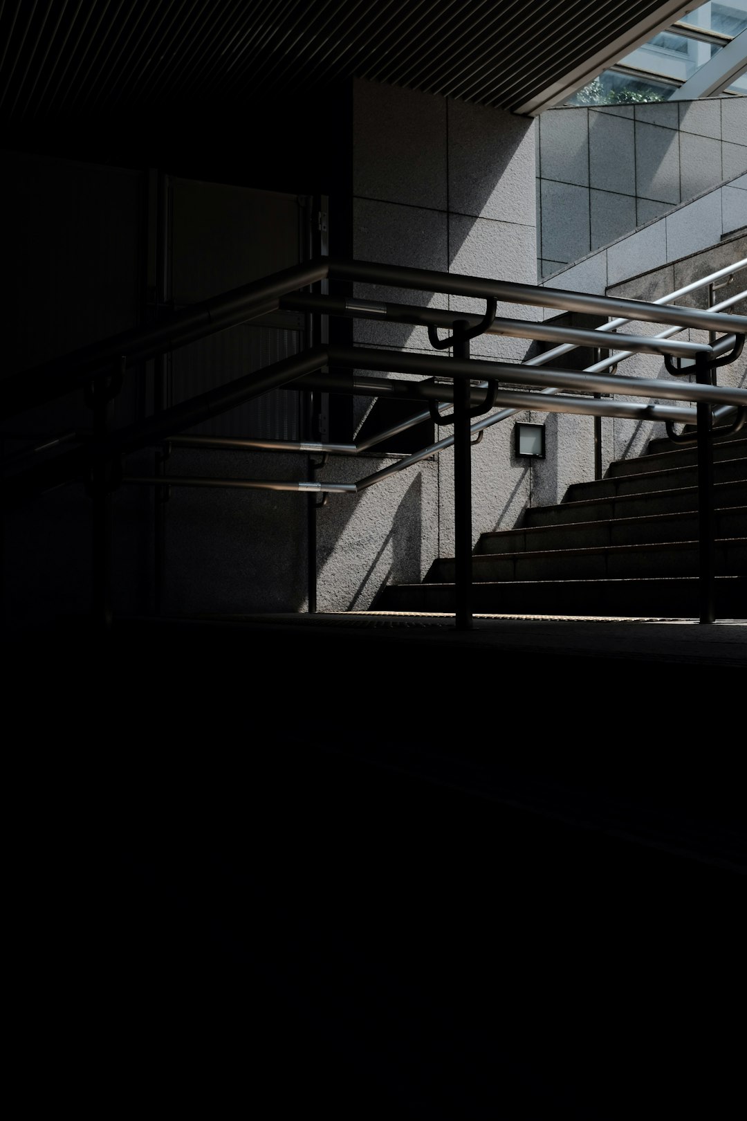 black metal staircase with black metal railings