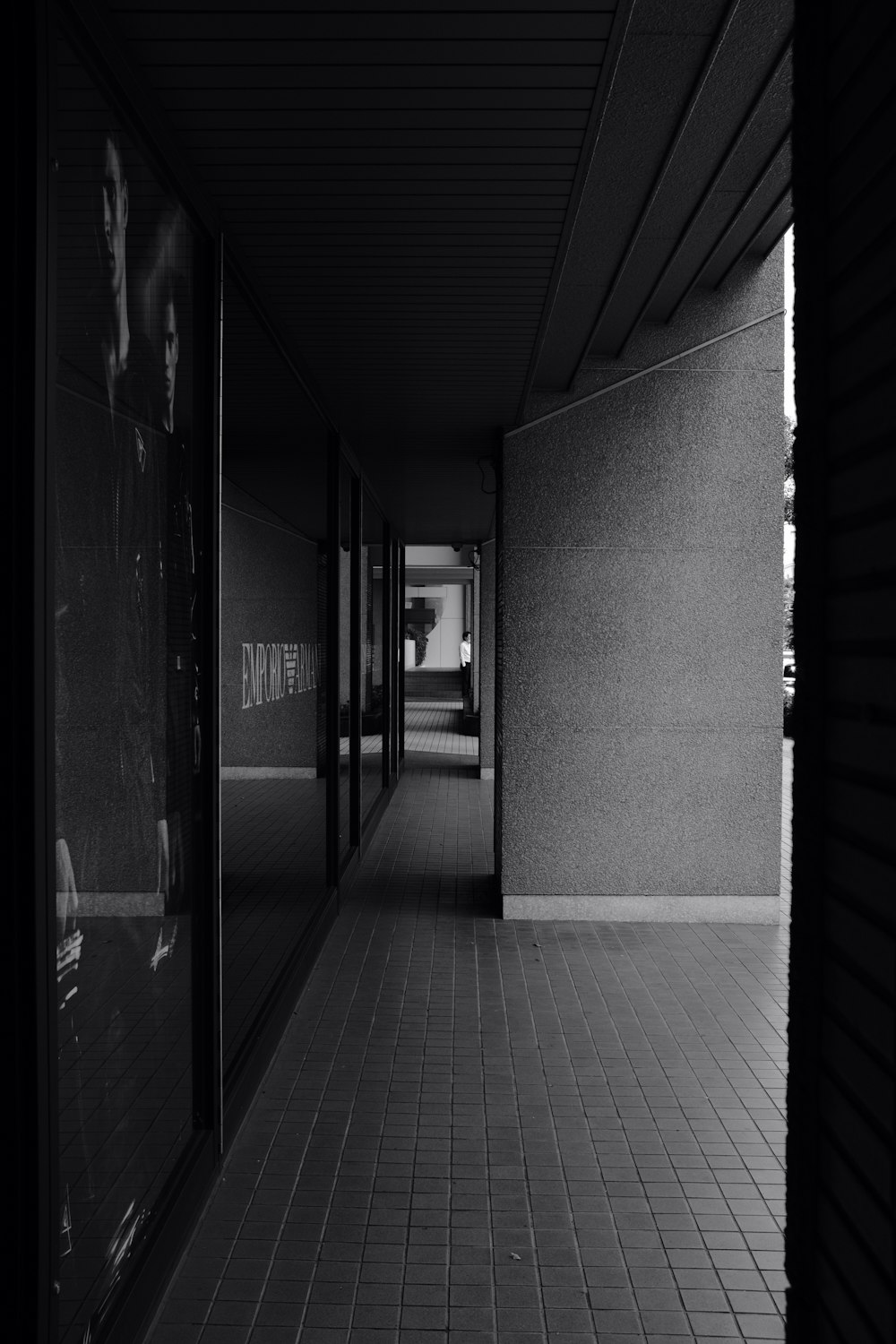 grayscale photo of hallway with no people