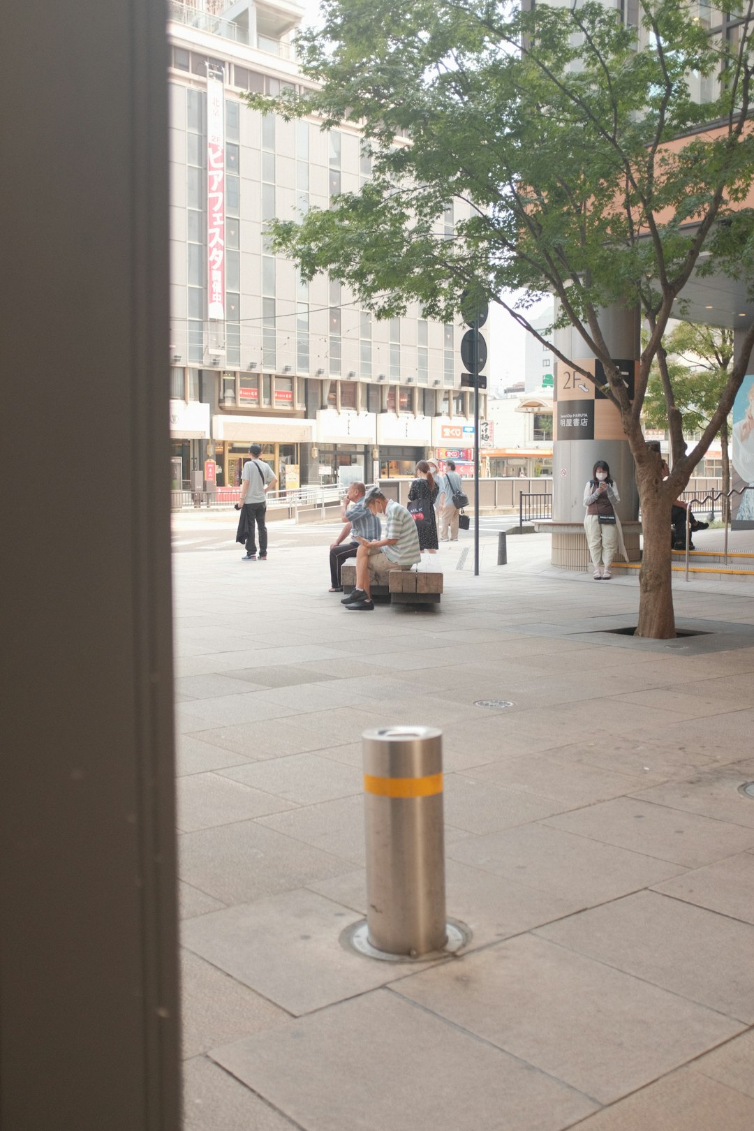 people walking on sidewalk during daytime