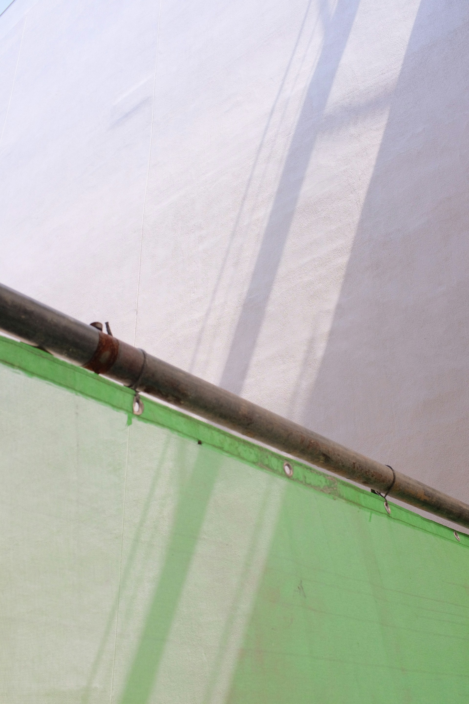 woman wearing yellow long-sleeved dress under white clouds and blue sky during daytime