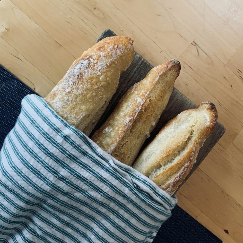 bread on blue and white striped textile