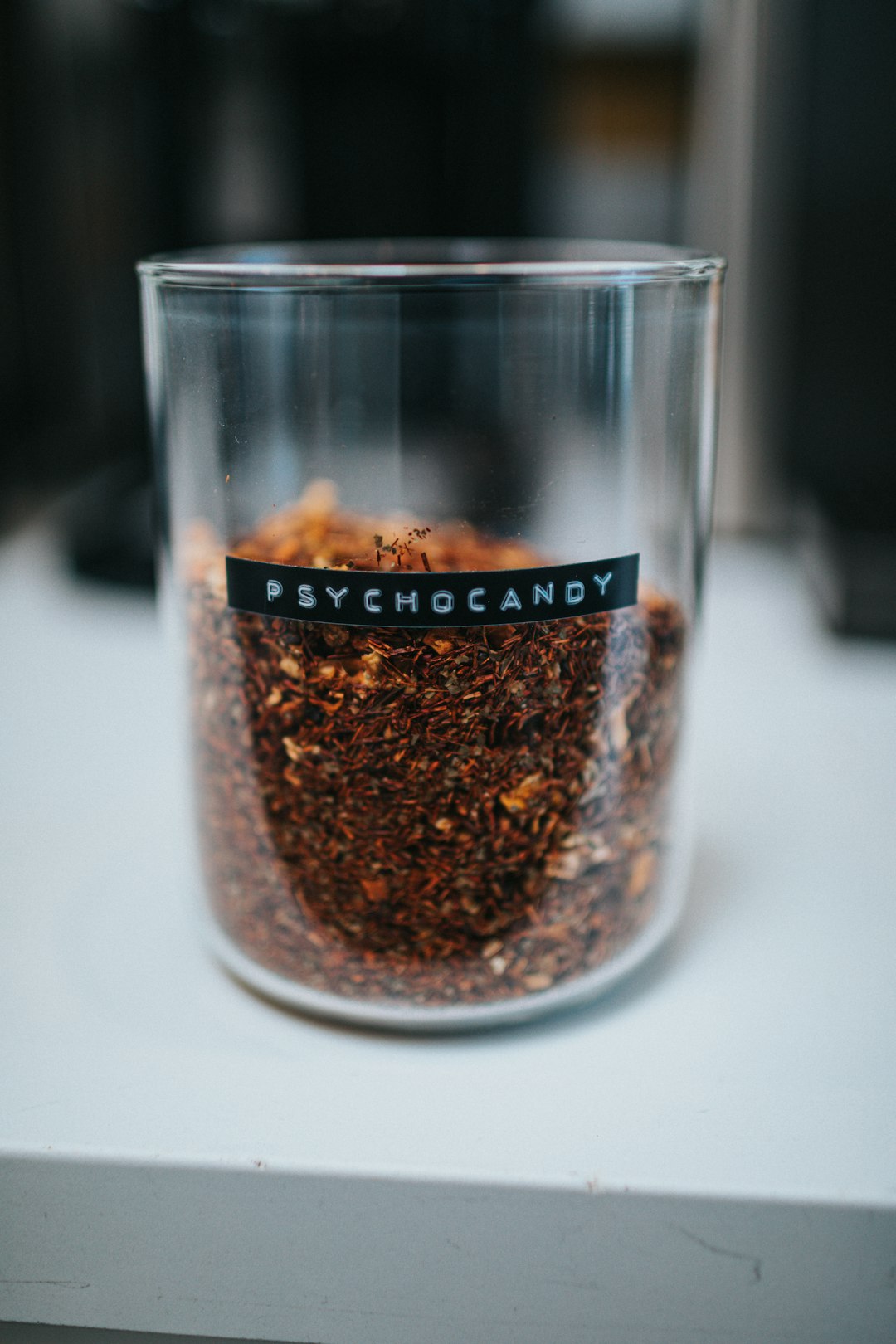 brown powder in clear glass container