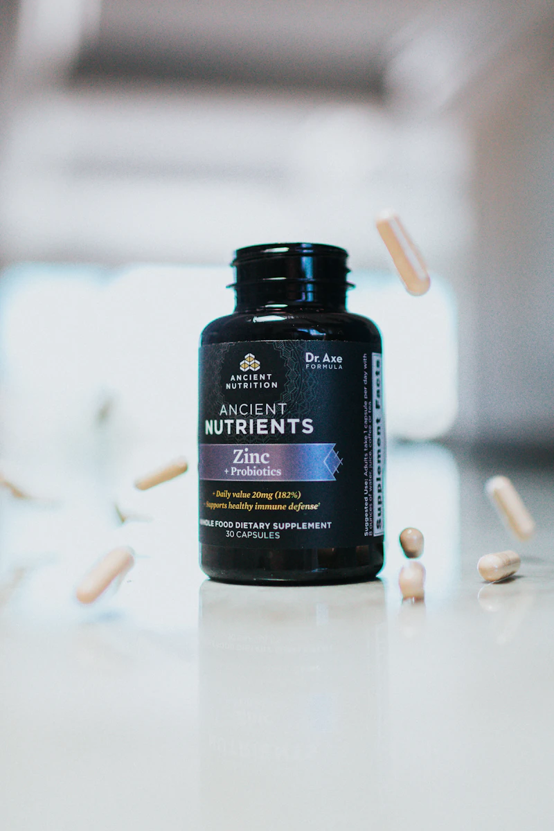 Catalyst daily wellness supplement bottle on a dark surface