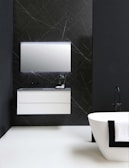 A stylish bathroom featuring contemporary fixtures and a sleek finish.