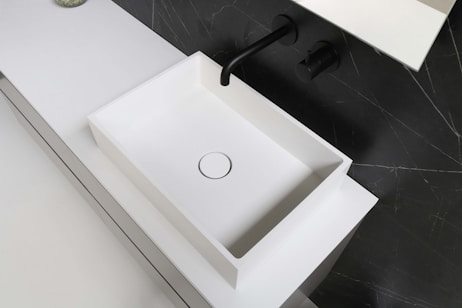 white ceramic sink with faucet