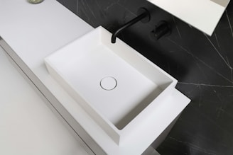 white ceramic sink with faucet