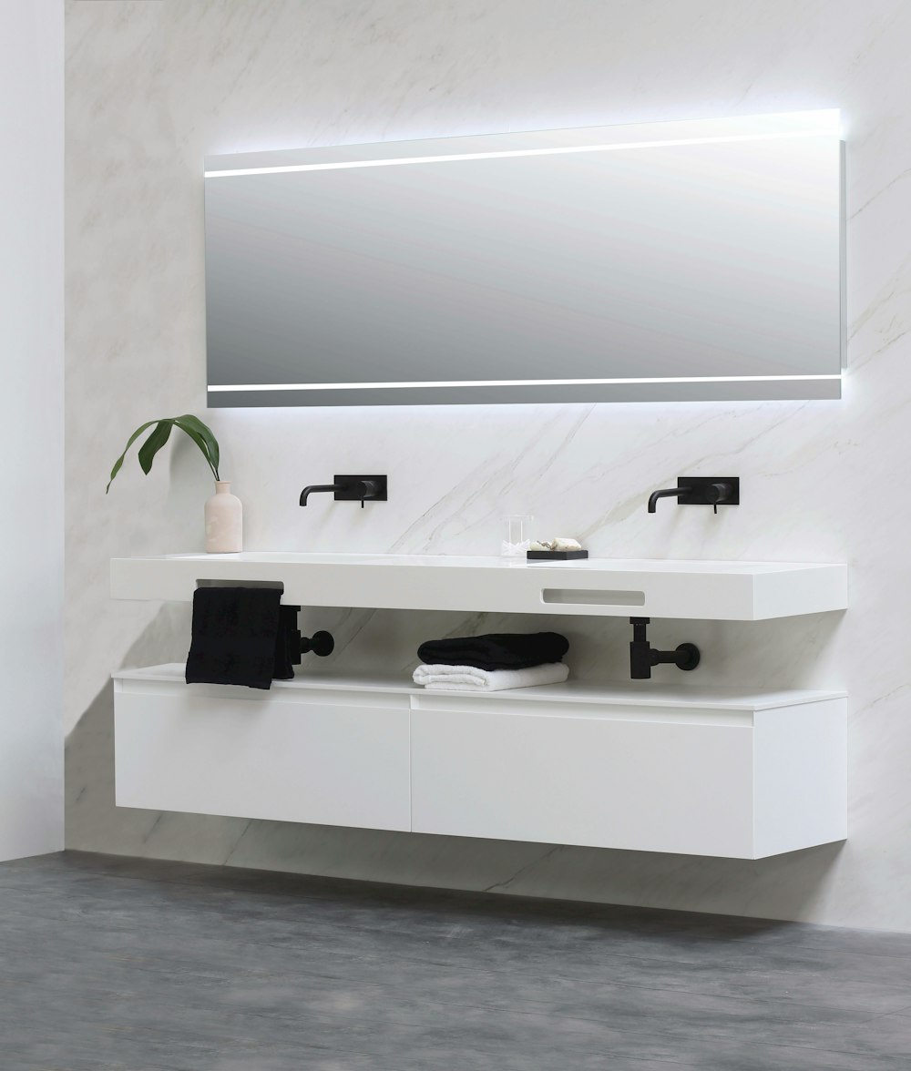 white ceramic sink with faucet