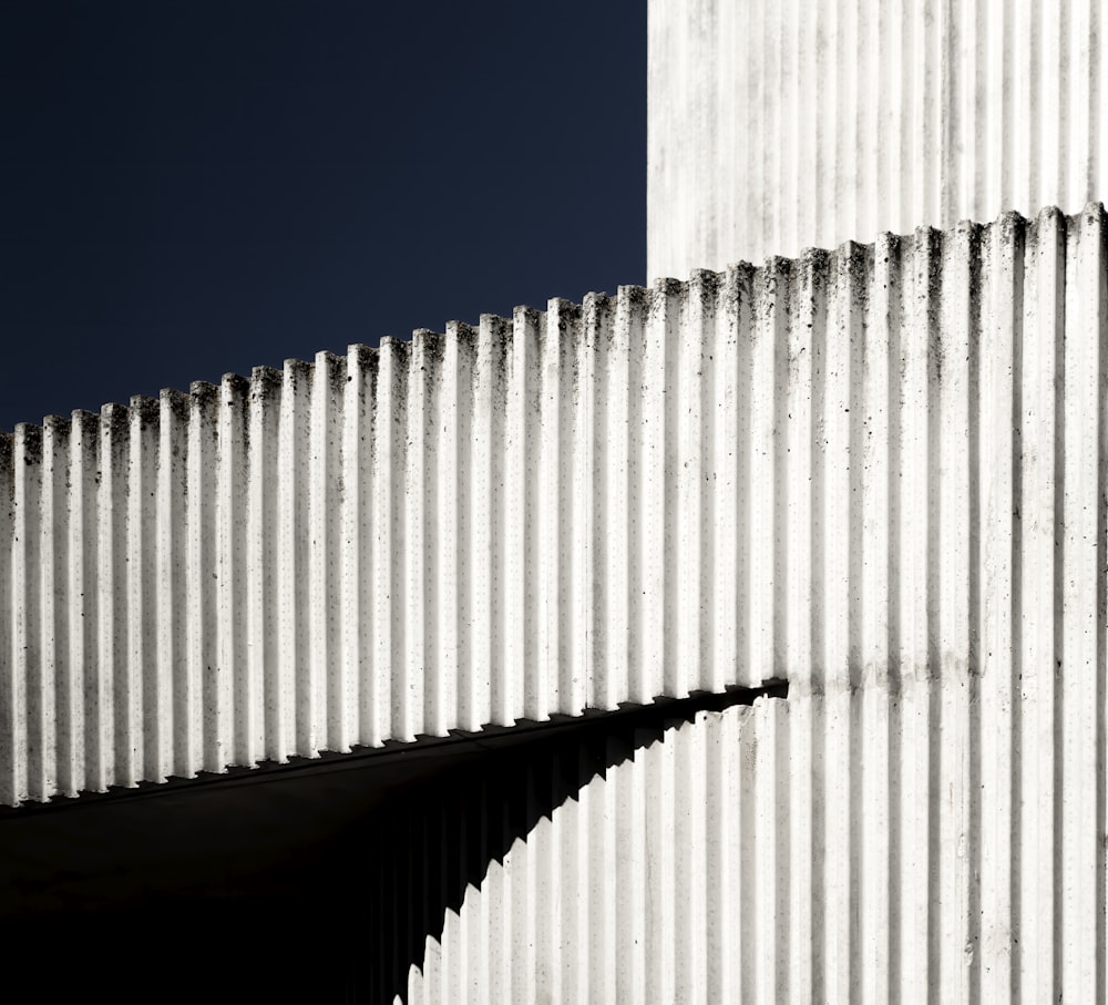 white concrete wall under blue sky during daytime