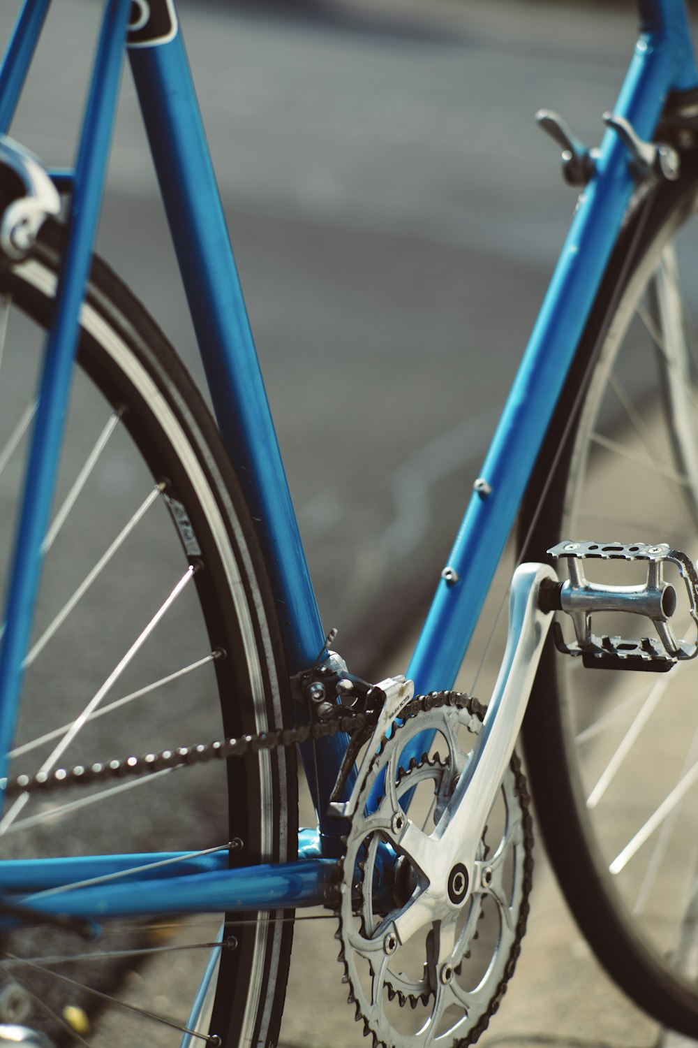 blue and black bicycle in close up photography