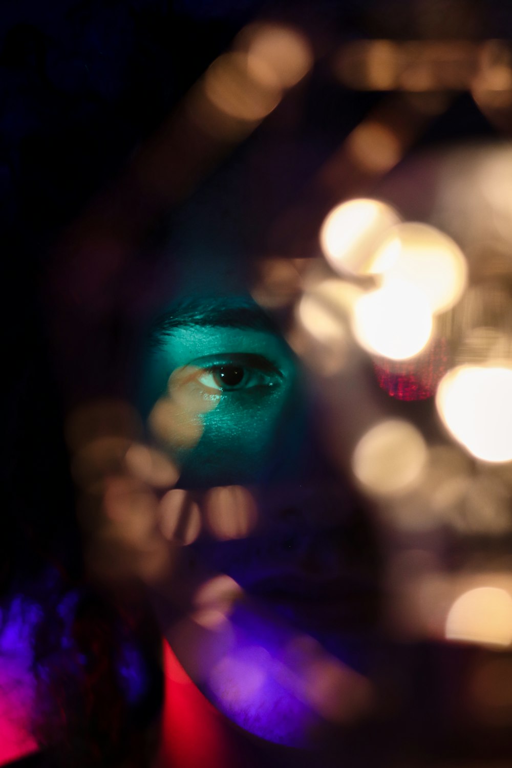 woman with blue and green face paint