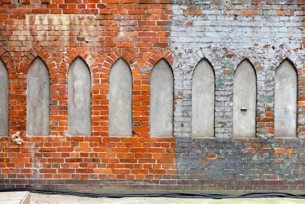 brown brick wall with gray concrete wall