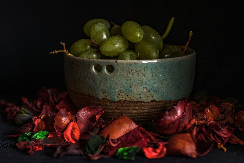 sliced green apple fruit on green ceramic bowl