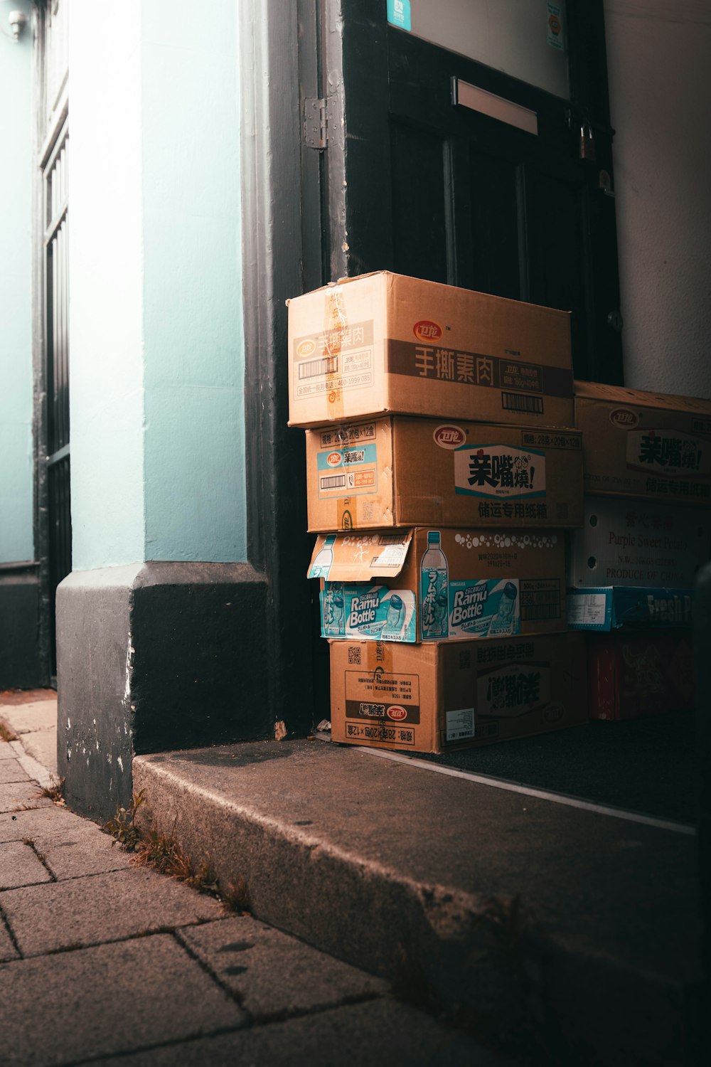 brown cardboard boxes on gray concrete floor