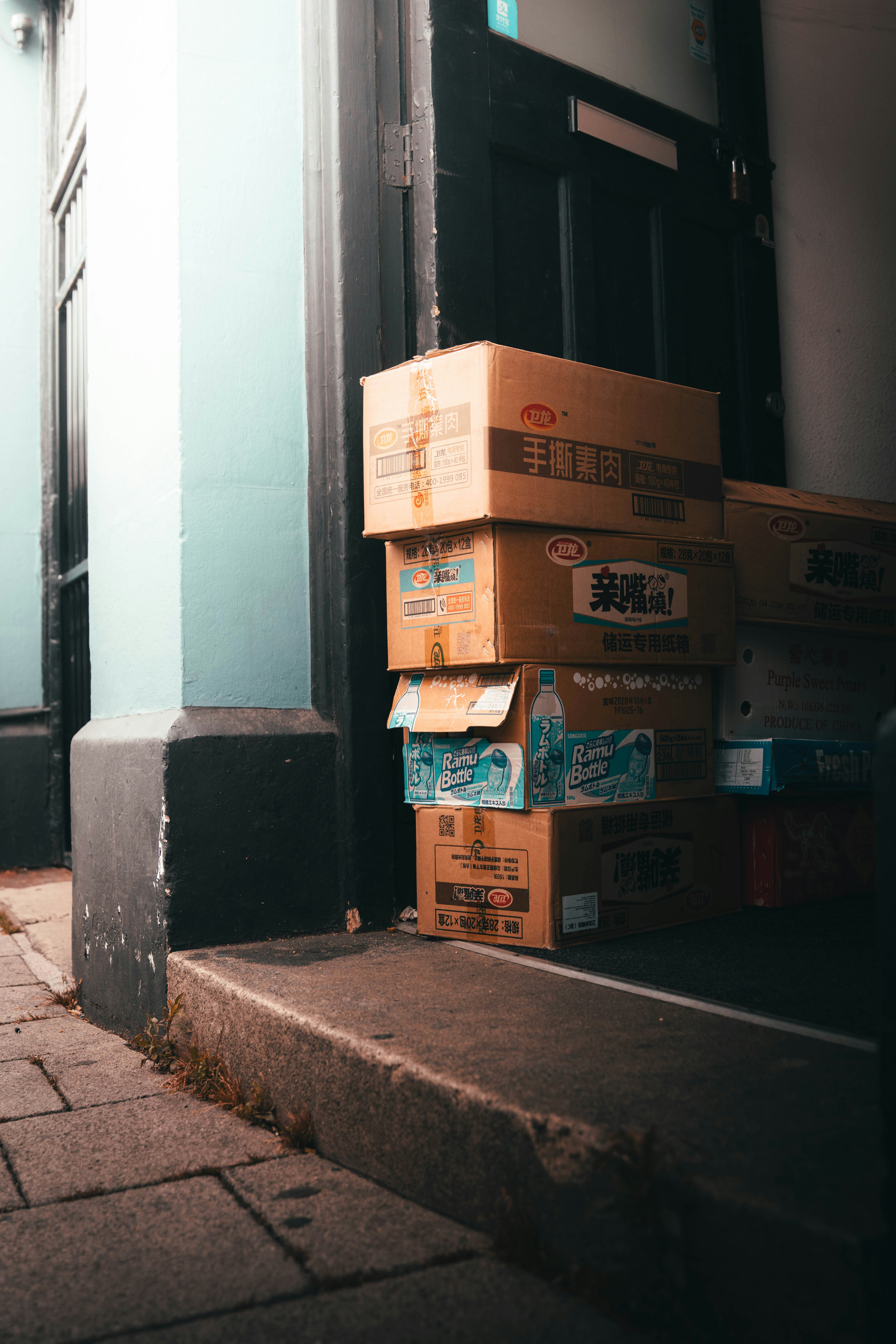 brown cardboard boxes on gray concrete floor