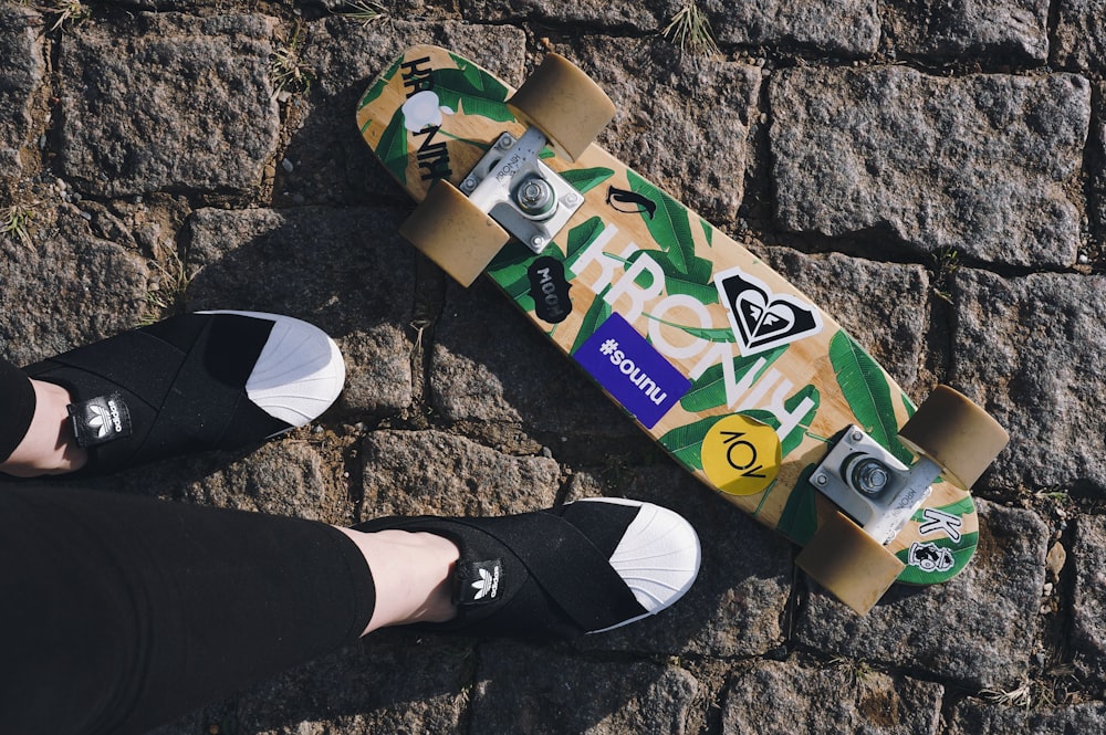 Person wearing black and white nike slide sandals photo – Free Skateboard  Image on Unsplash