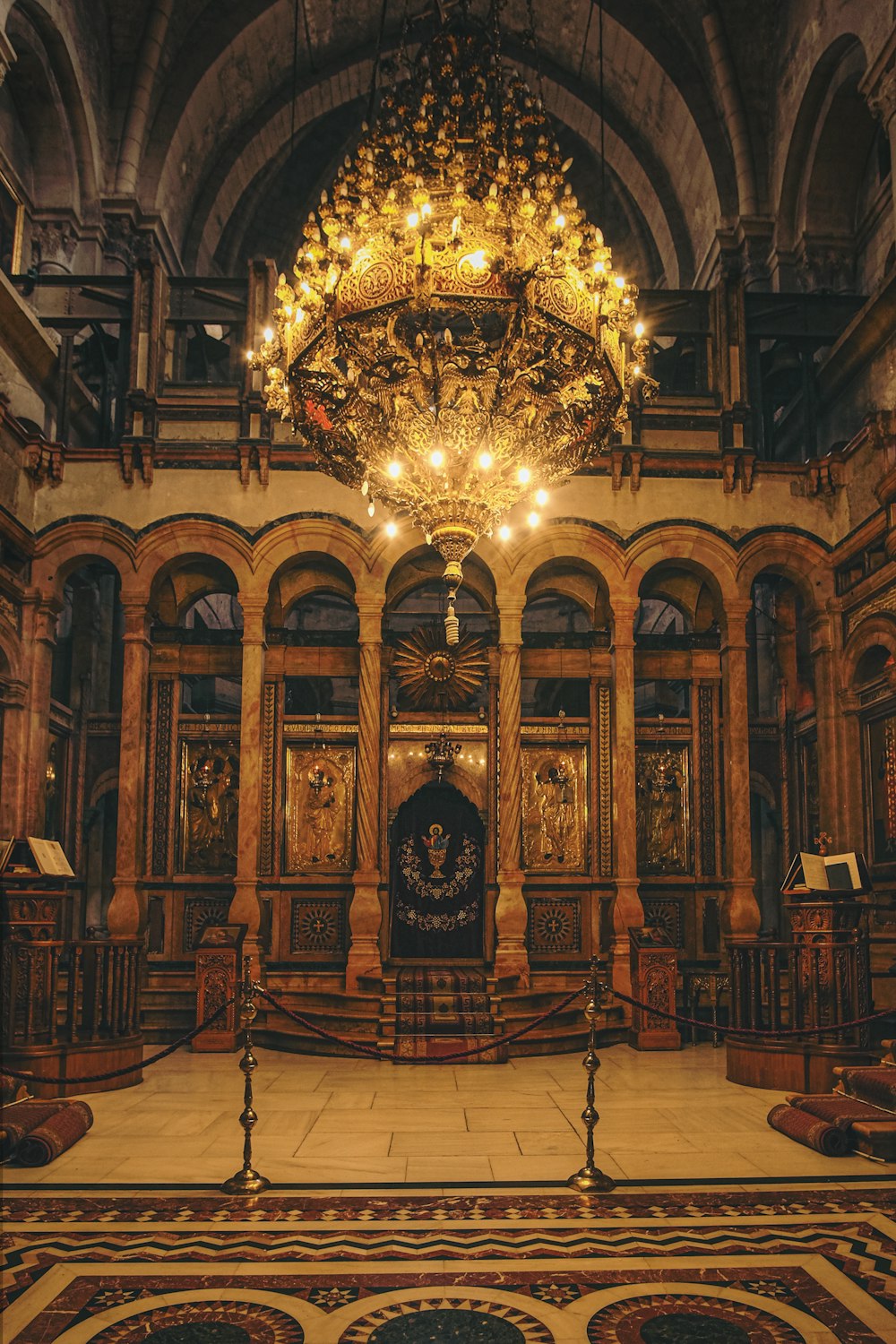 gold and silver chandelier on brown wooden ceiling