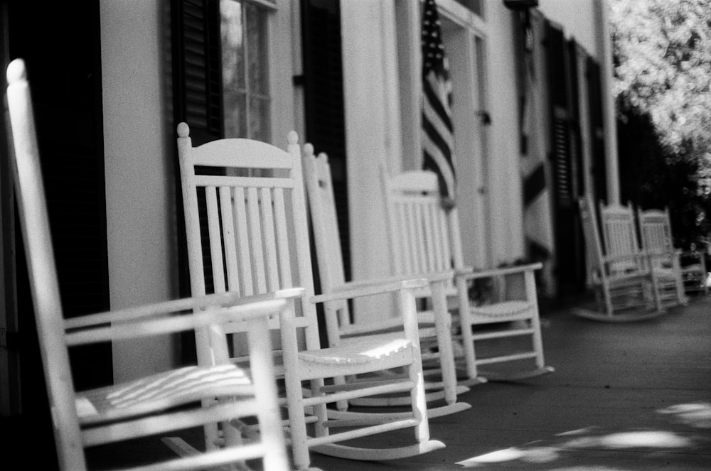 grayscale photo of wooden rocking chair