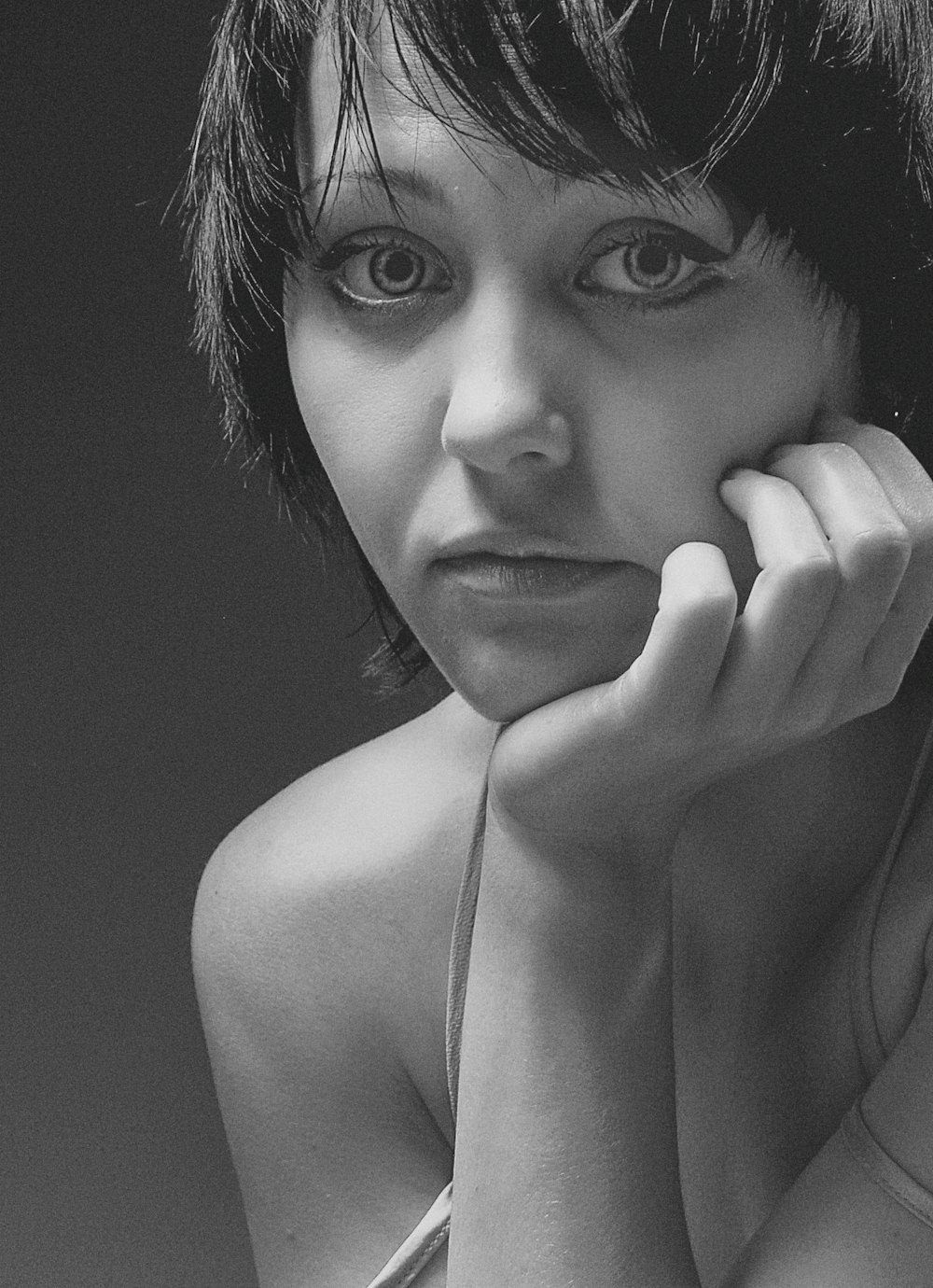 grayscale photo of woman with eyes closed