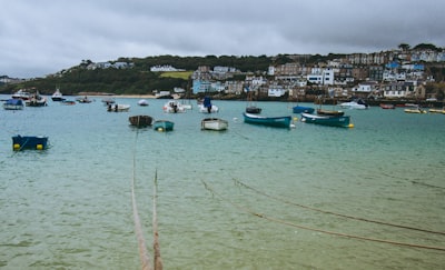 boats on sea under cloudy sky during daytime st. nick zoom background