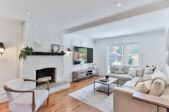 living room with white sofa and black flat screen tv