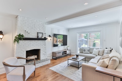 living room with white sofa and black flat screen tv