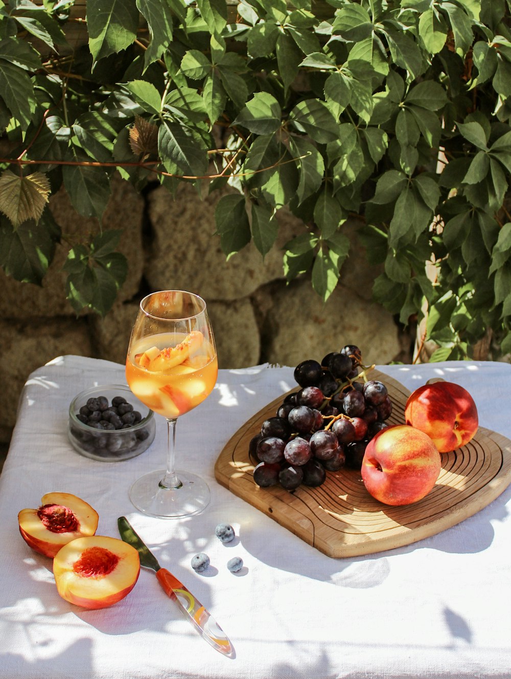 grapes and grapes on brown wooden tray