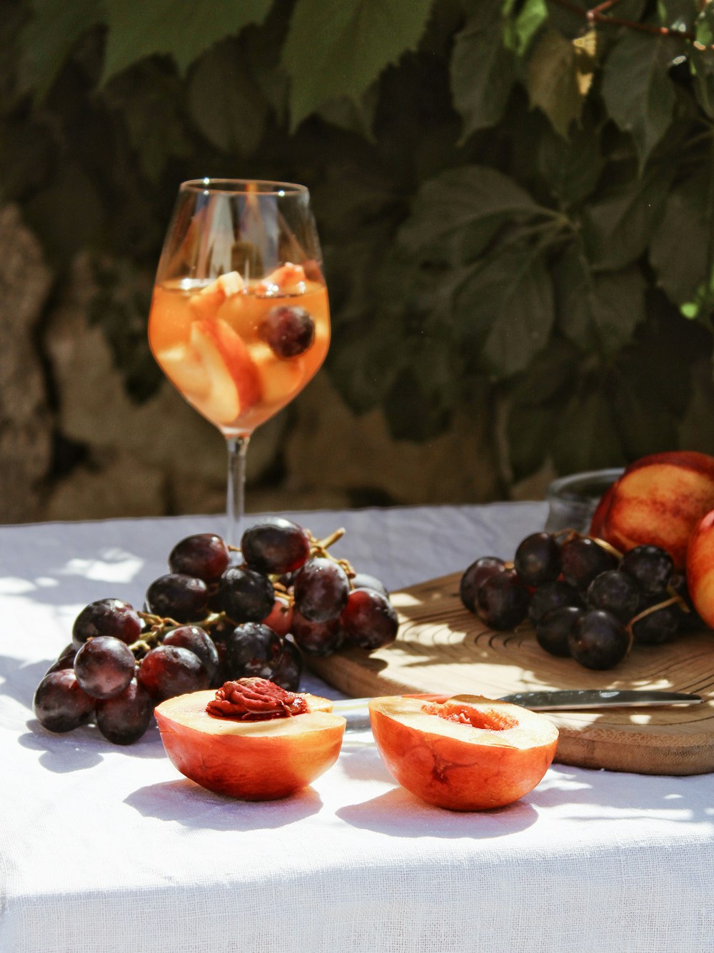 grapes and orange fruit on table