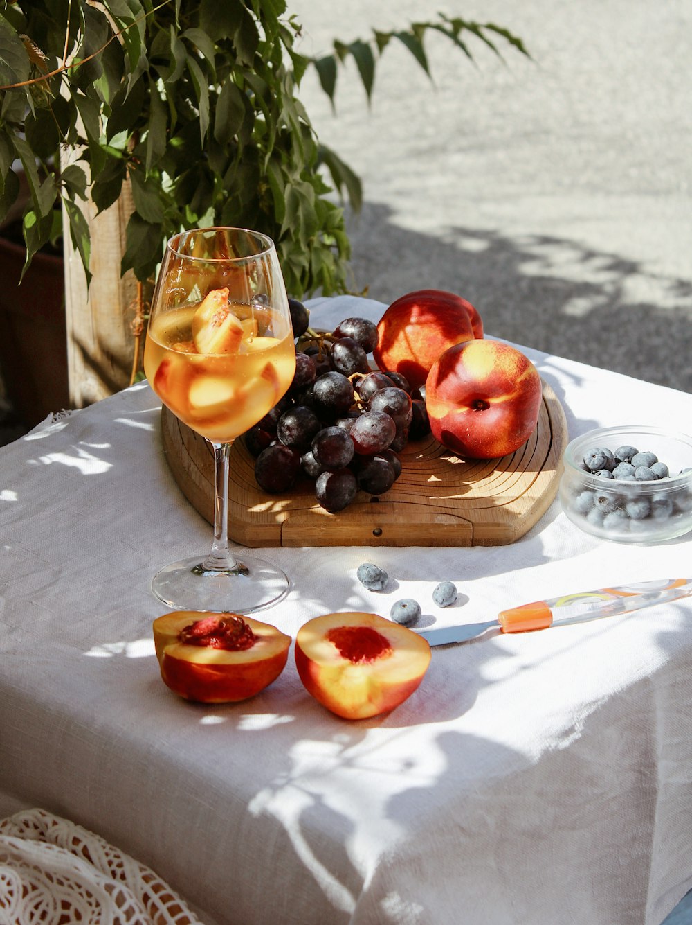 red apple fruit on brown wooden tray