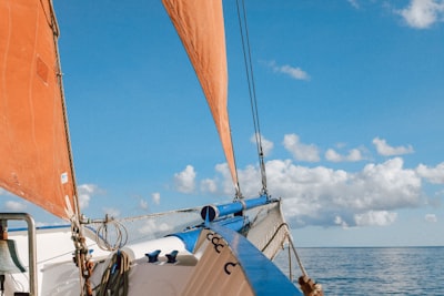 white and black boat on sea during daytime papua new guinea google meet background