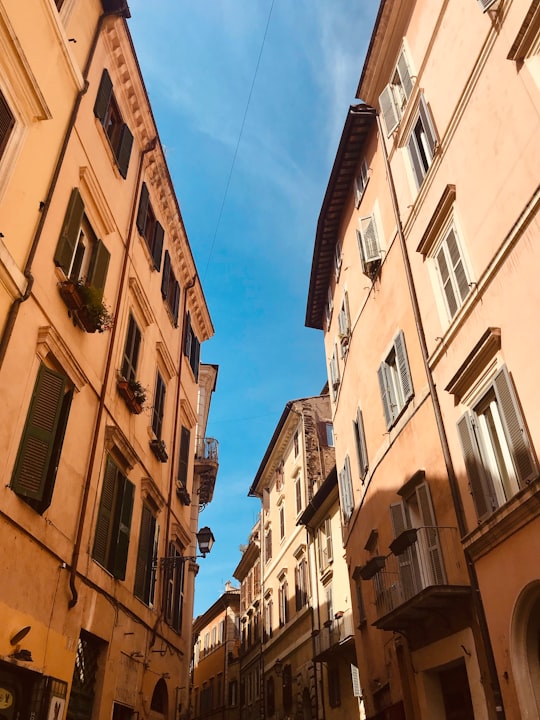 yellow concrete building during daytime in Palazzo Vecchio Italy