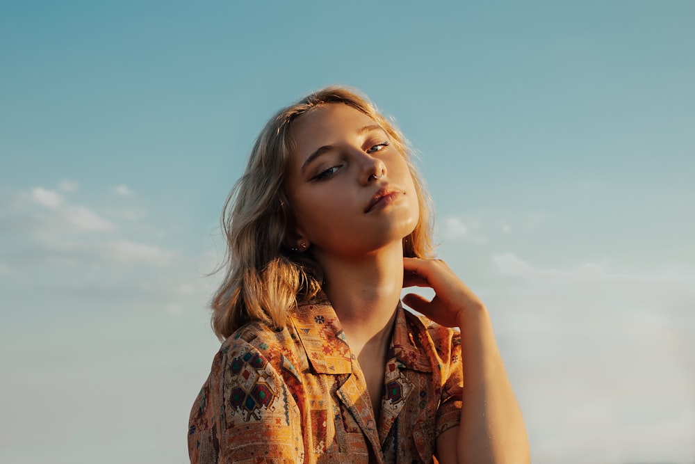 woman in brown and black floral button up shirt