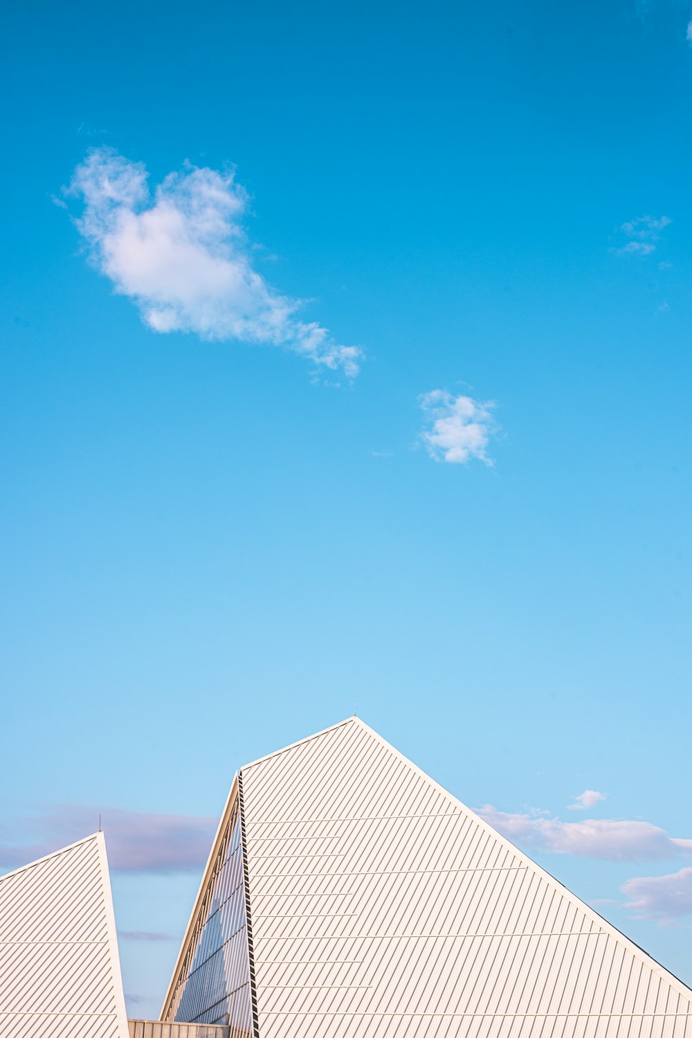 white and gray building under blue sky during daytime