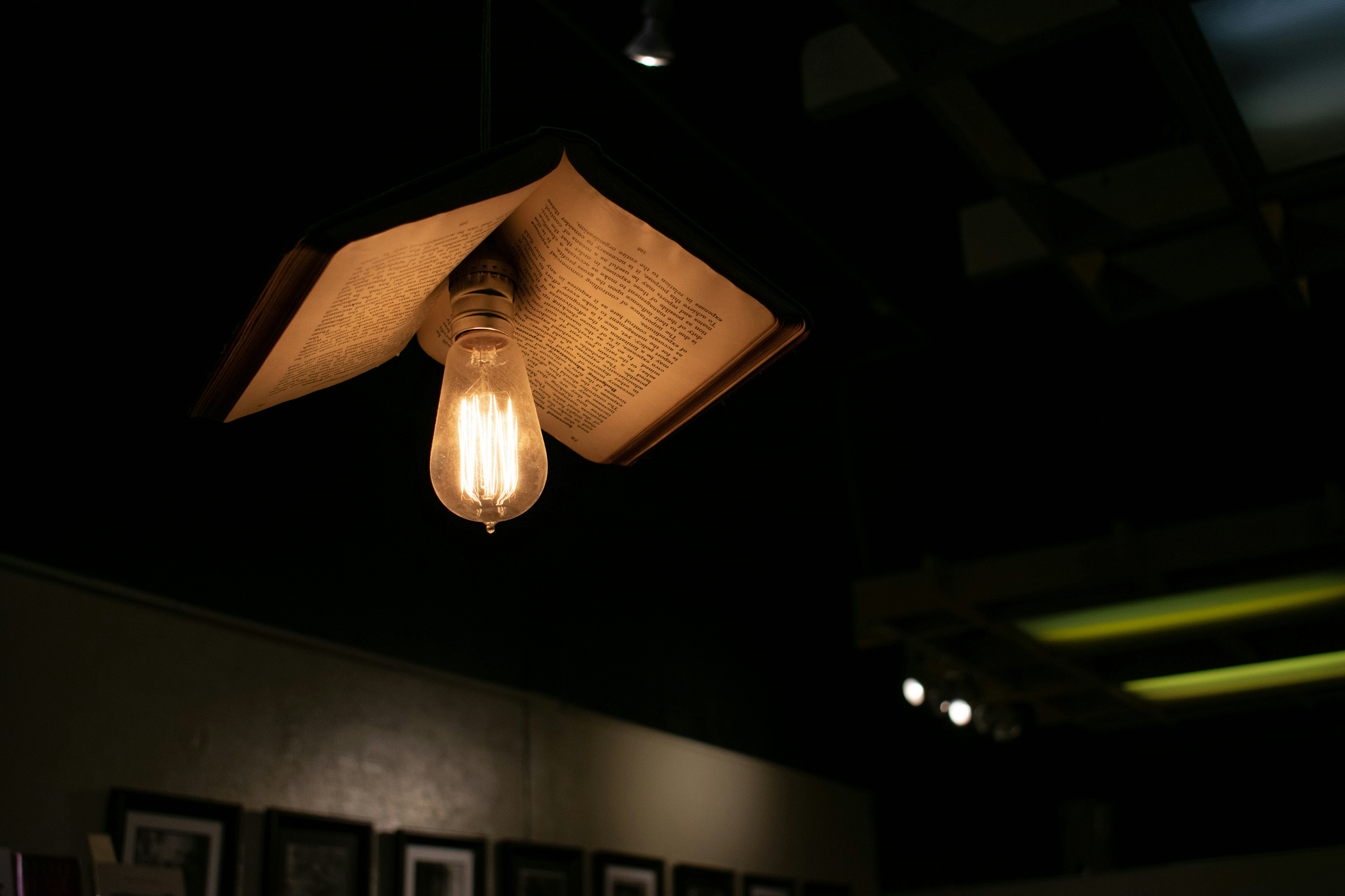 brown pendant lamp turned on in room